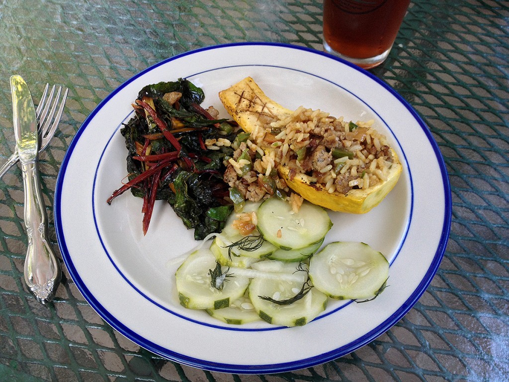 Dinner! Grilled summer squash, stuffed with a sweet sausage, onion & pepper rice. Accompanied by wilted chard, and a cool summer cucumber salad. Yum!